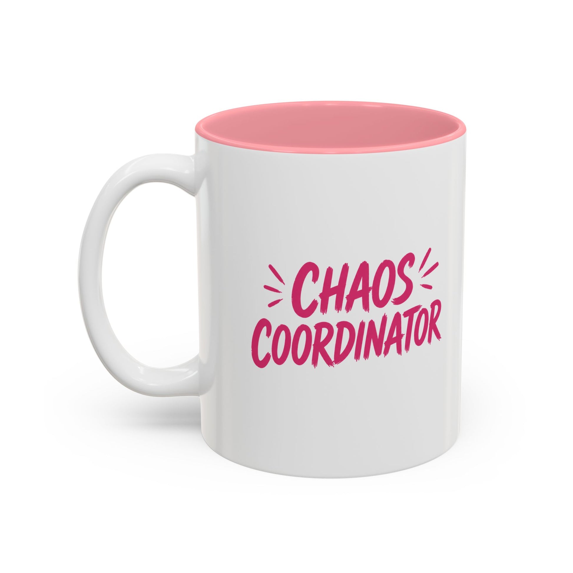 White coffee mug with pink interior featuring bold pink Chaos Coordinator text design