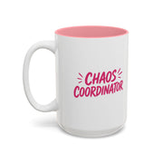 White coffee mug with pink interior featuring bold pink Chaos Coordinator text design