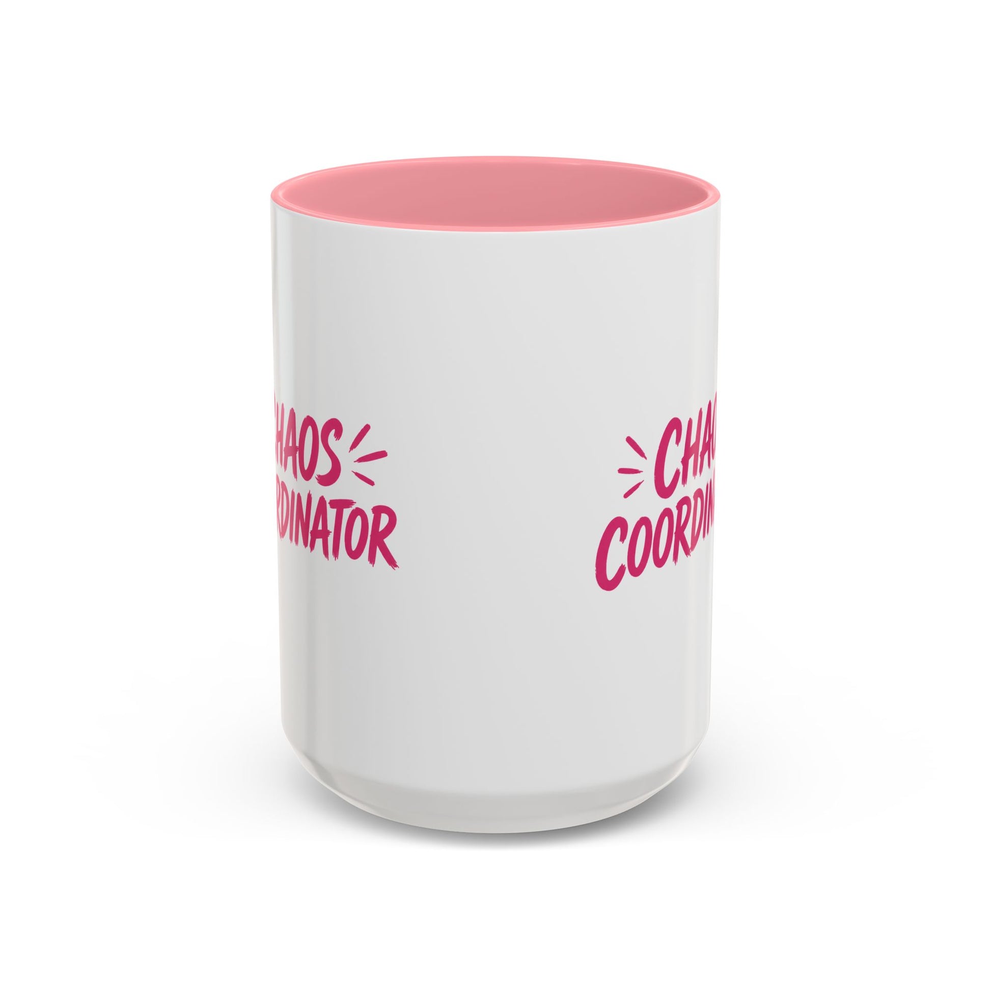 White coffee mug with pink interior featuring bold pink Chaos Coordinator text design