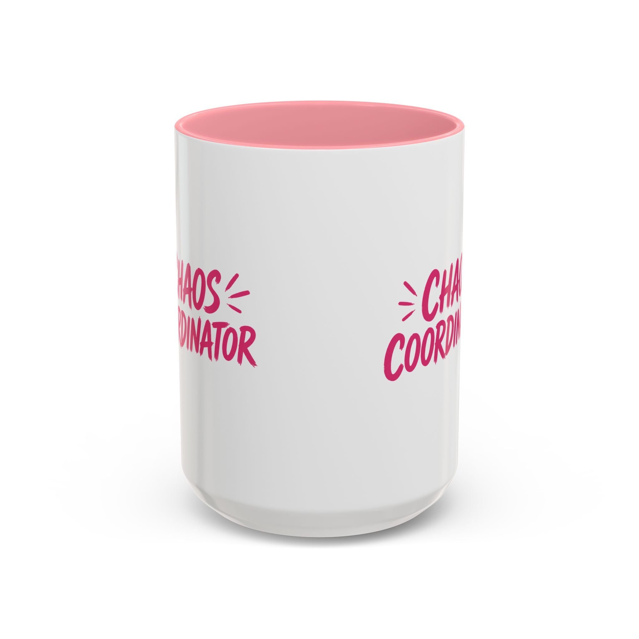 White coffee mug with pink interior featuring bold pink Chaos Coordinator text design