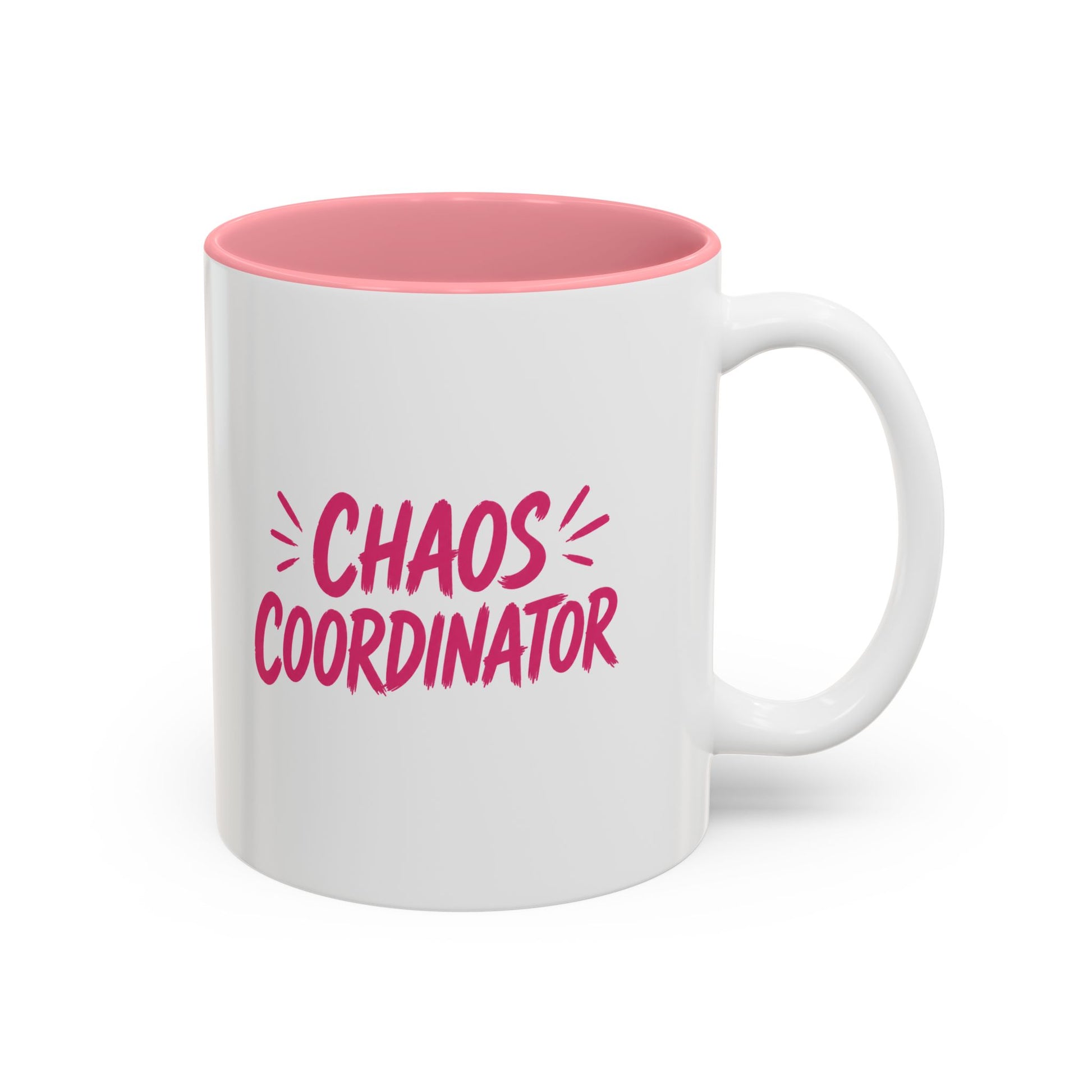 White coffee mug with pink interior featuring bold pink Chaos Coordinator text design